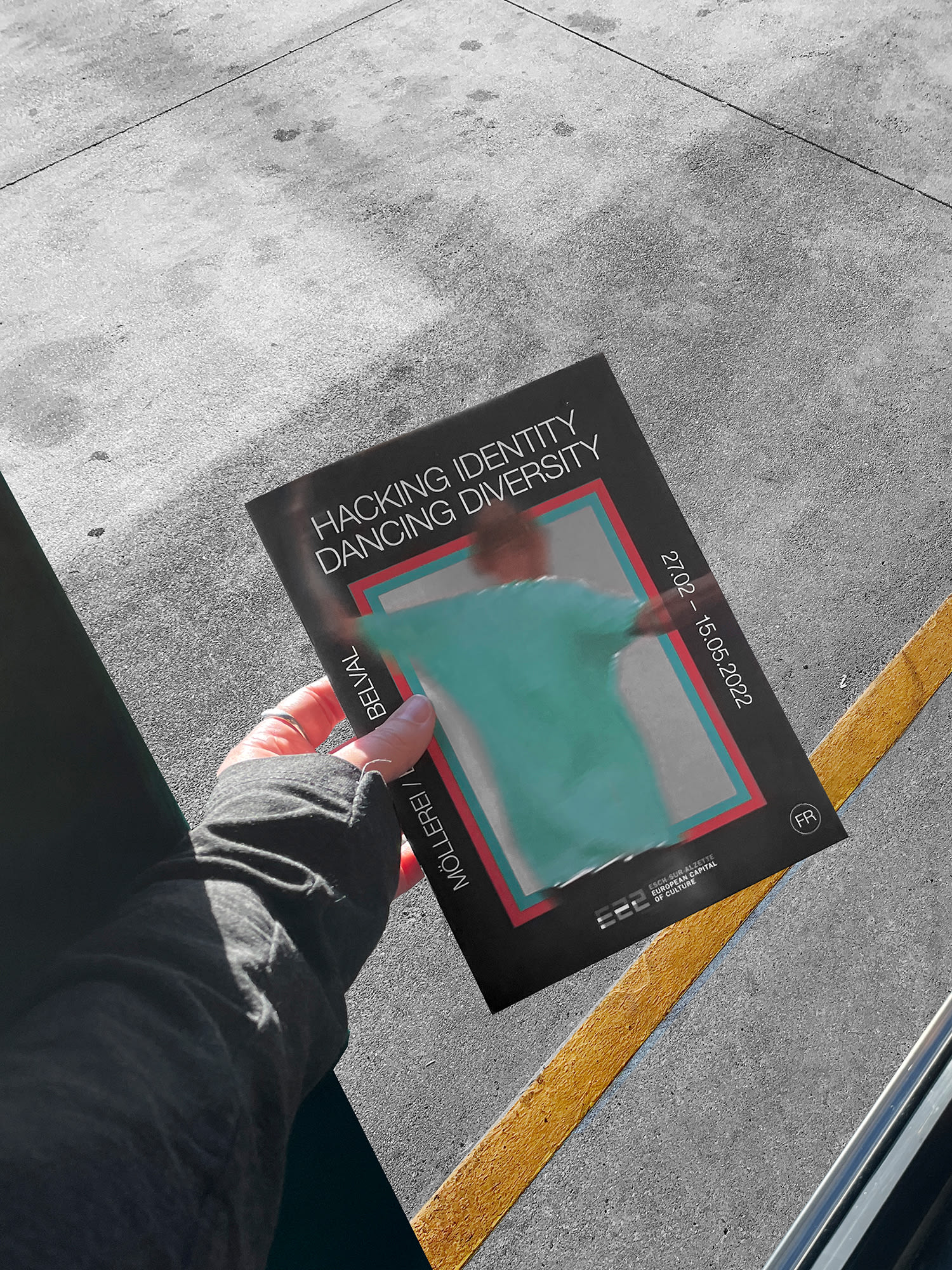 Magazine cover held by one hand