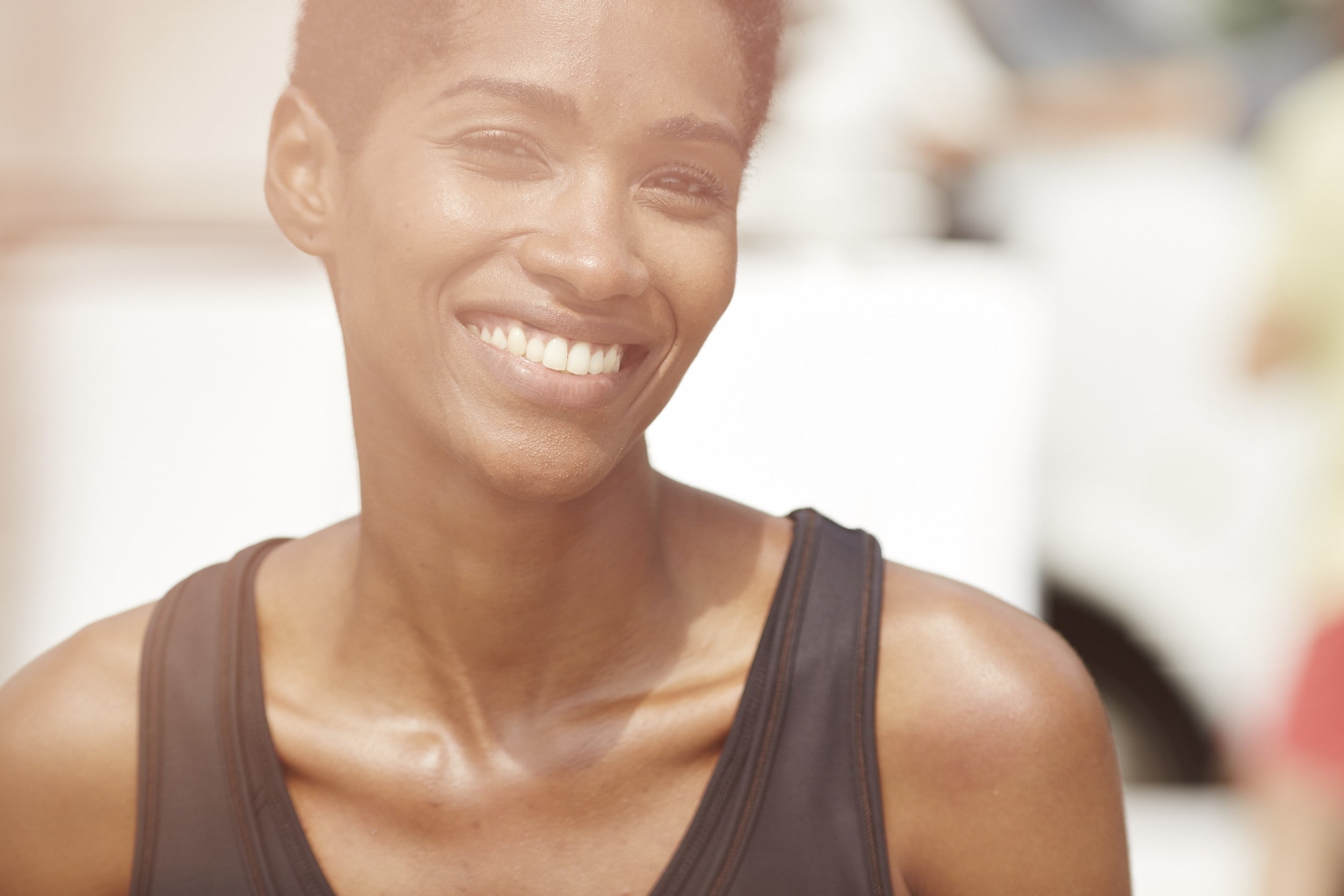 Smiling woman in sports clothes