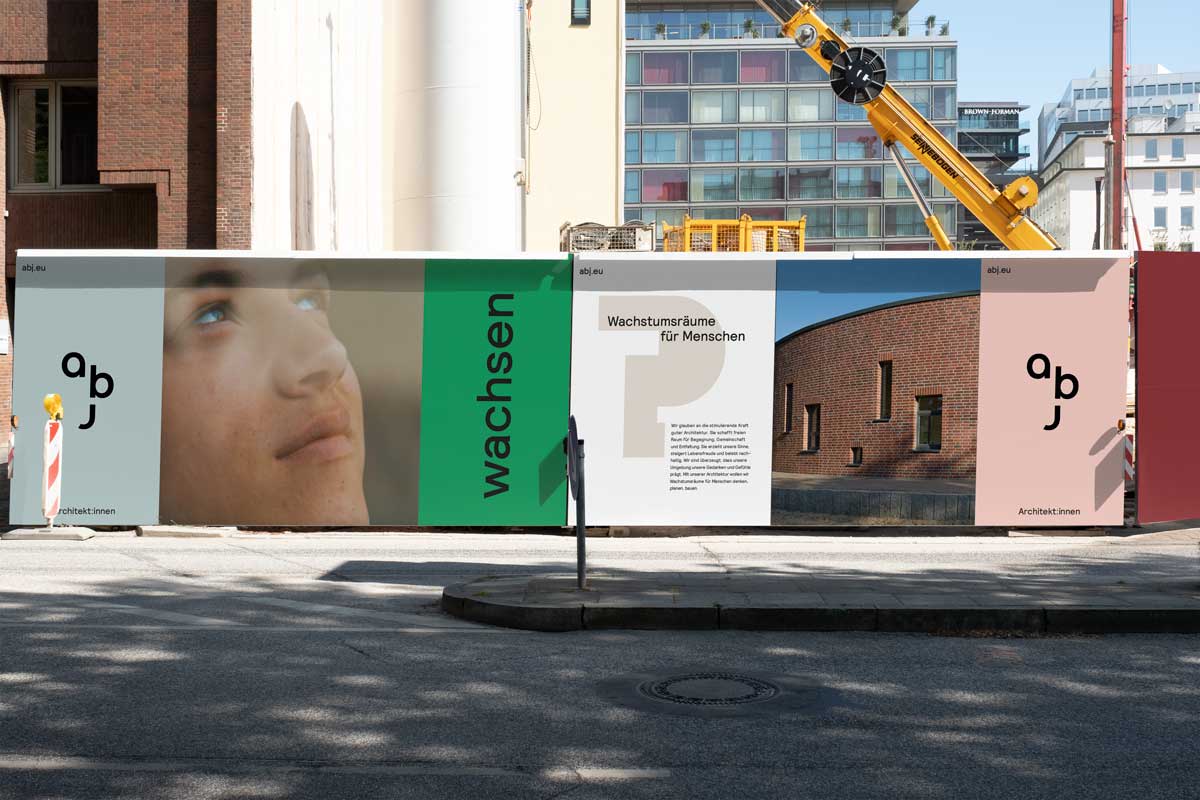 Construction fence with posters of abj