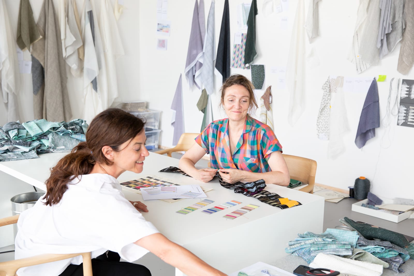 Isa Glink and Inga Sempé in the kvadrat rooms, surrounded by hangersheets and fabric samples