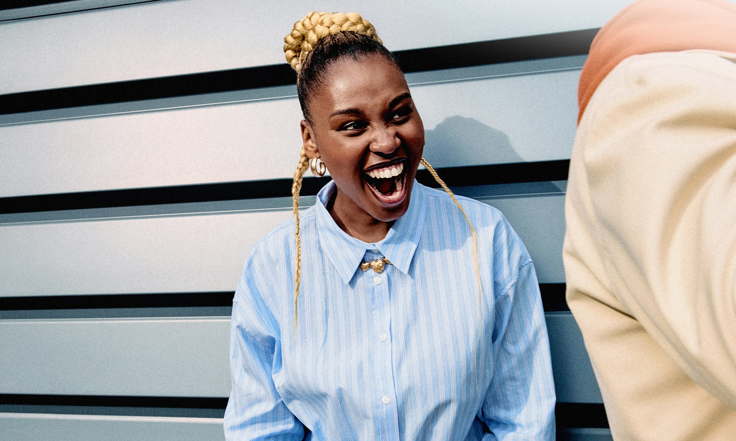 Woman with a broad smile and a cheerful expression on her face