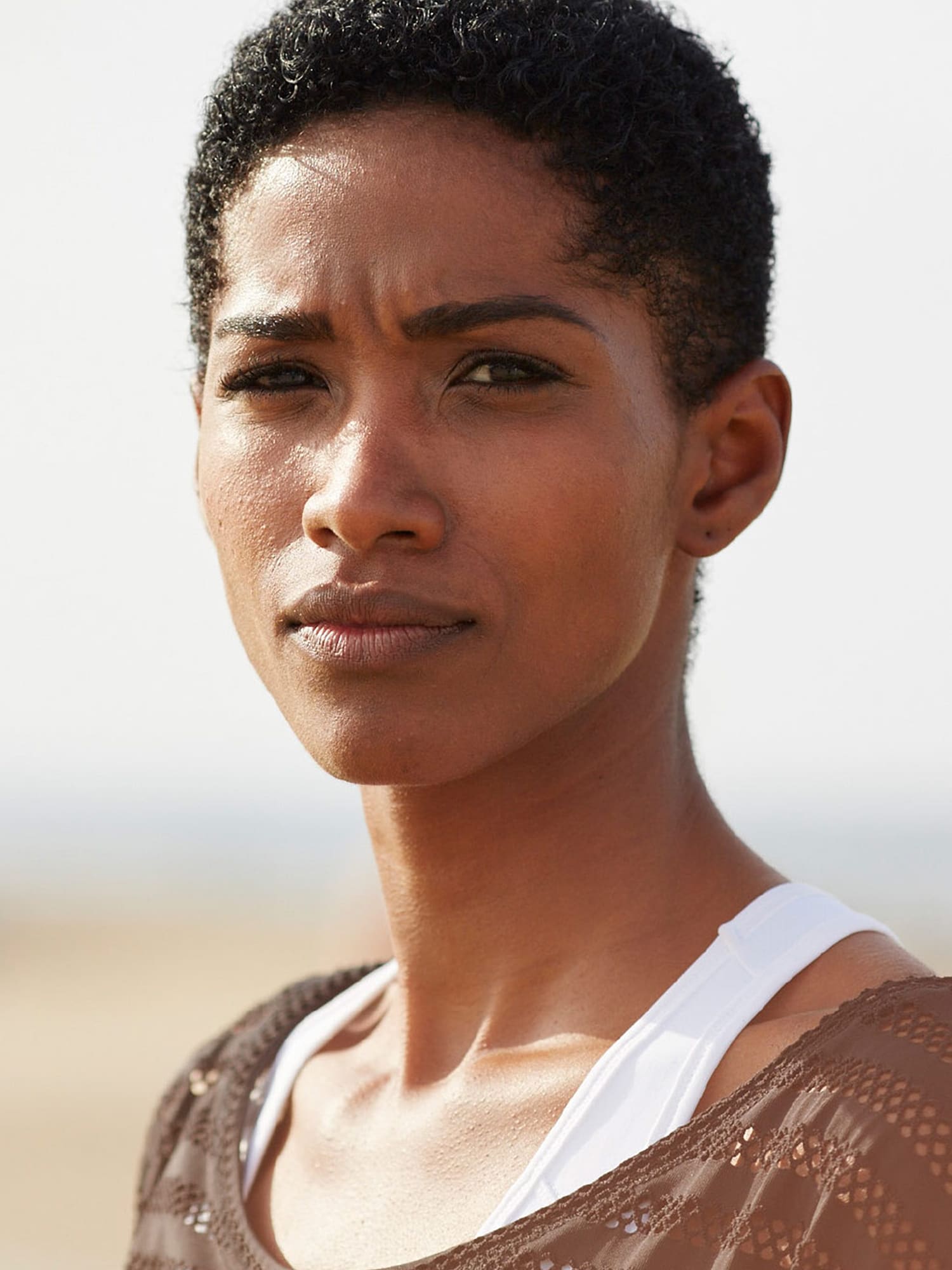 Campaign photography of portrait of woman in desert landscape