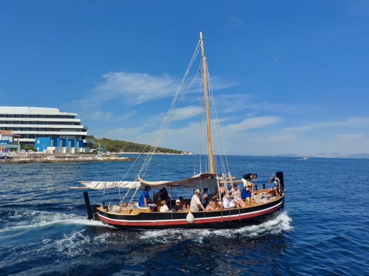 People in boat near coast