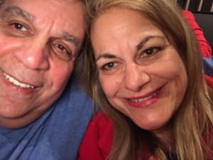 Headshot of Richard & Karen, Managing Partners of Just Happy Dogs LLC shown together and smiling to put a human face on our business.