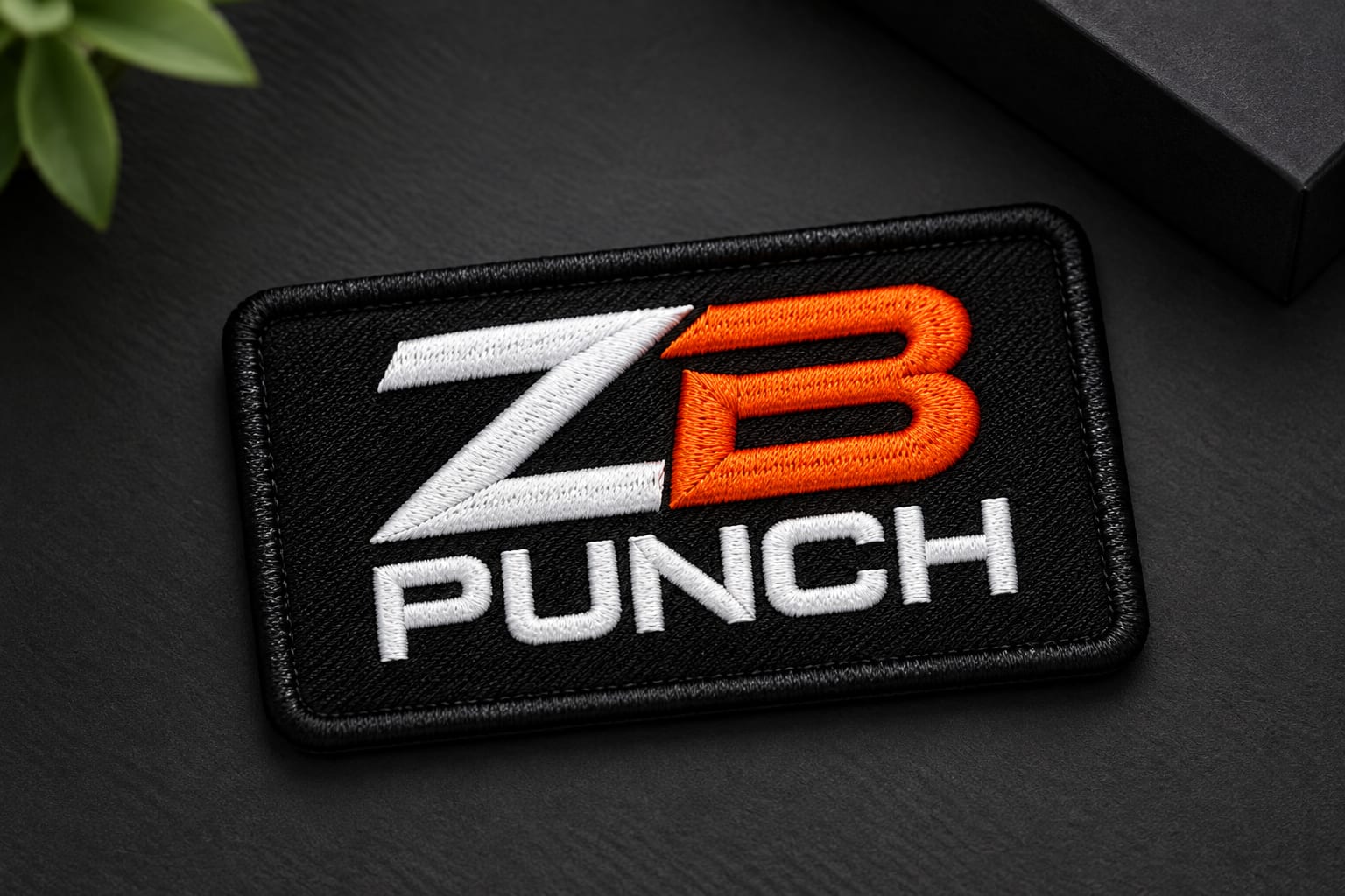 An embroidered ZB Punch patch with a merrowed border