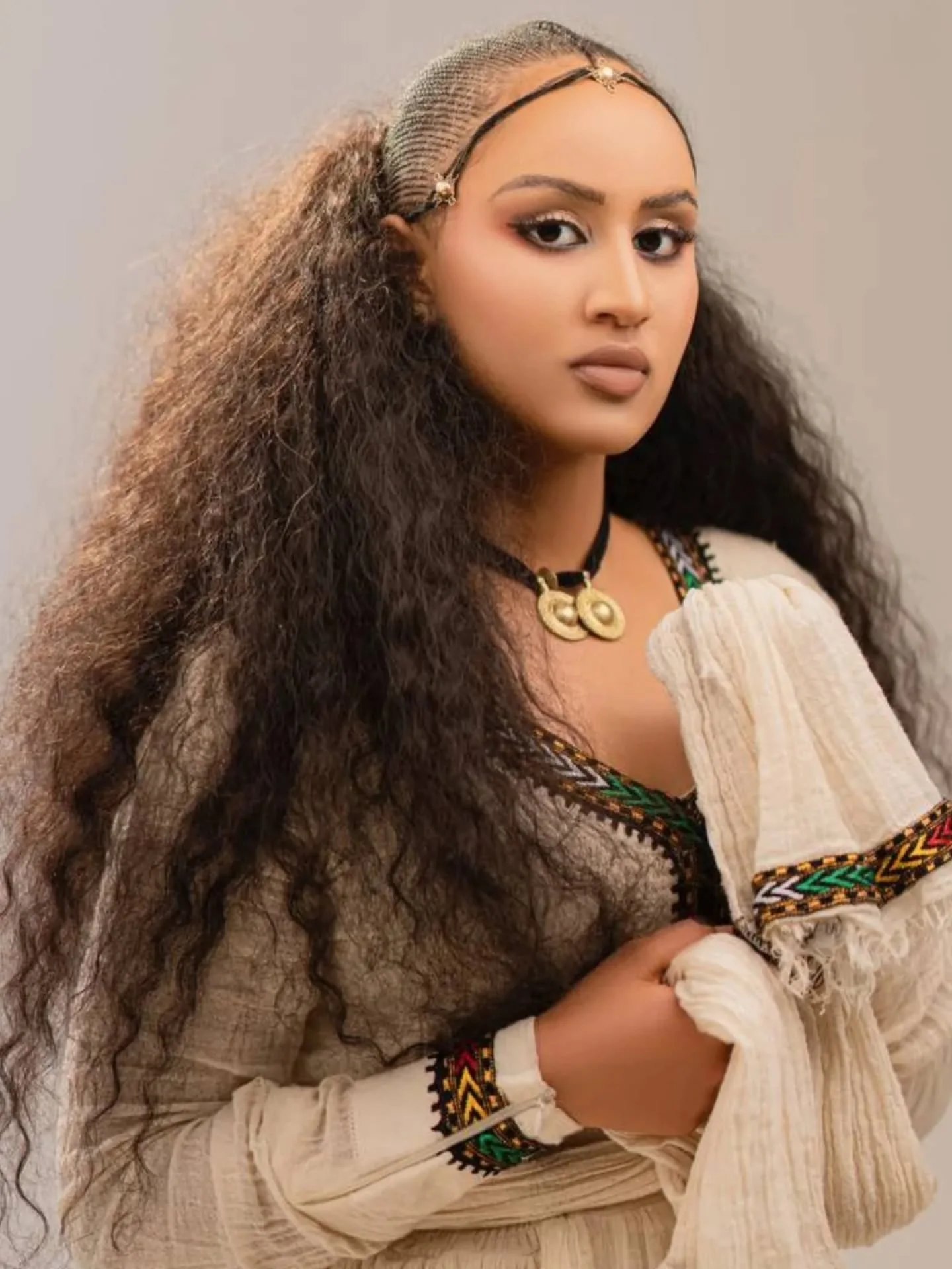 Cream Habesha dress with colorful embroidery | ባለቀለም ጥልፍ ያለው የሀበሻ ቀሚስ (image 3)