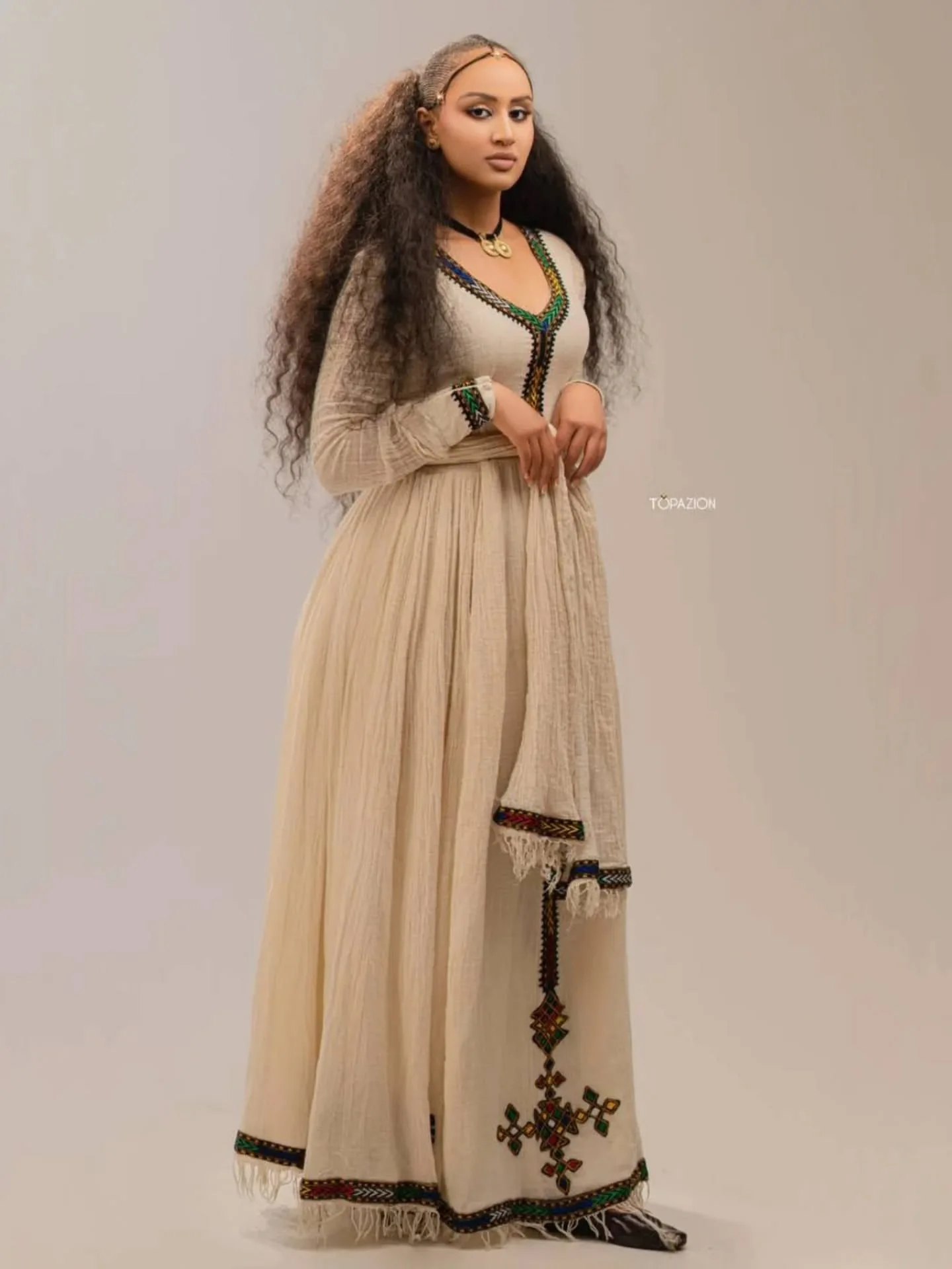 Cream Habesha dress with colorful embroidery | ባለቀለም ጥልፍ ያለው የሀበሻ ቀሚስ