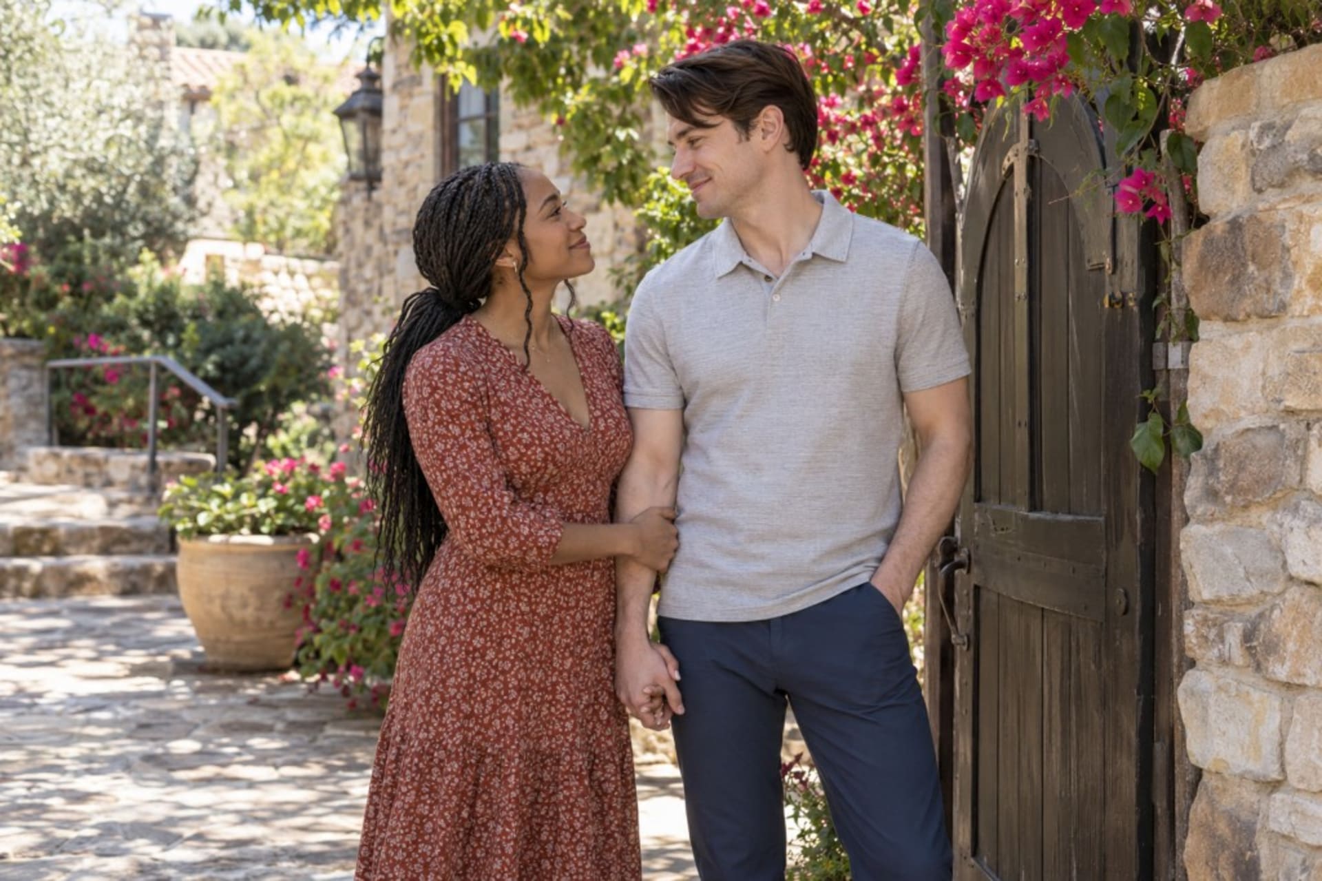 Romantic retreats for couples: more than a getaway, a couple holding hands at a garden gate