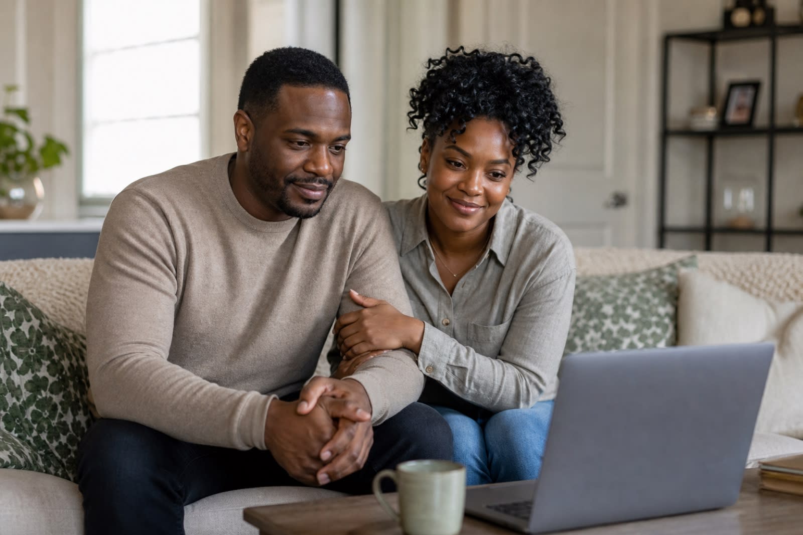 Couple in Los Angeles sharing a hopeful online couples therapy session from home