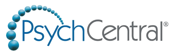 PsychCentral logo with blue and gray text; blue spheres form a curved line arching over the letter "P," evoking the calm and balance found at a wellness retreat near me.