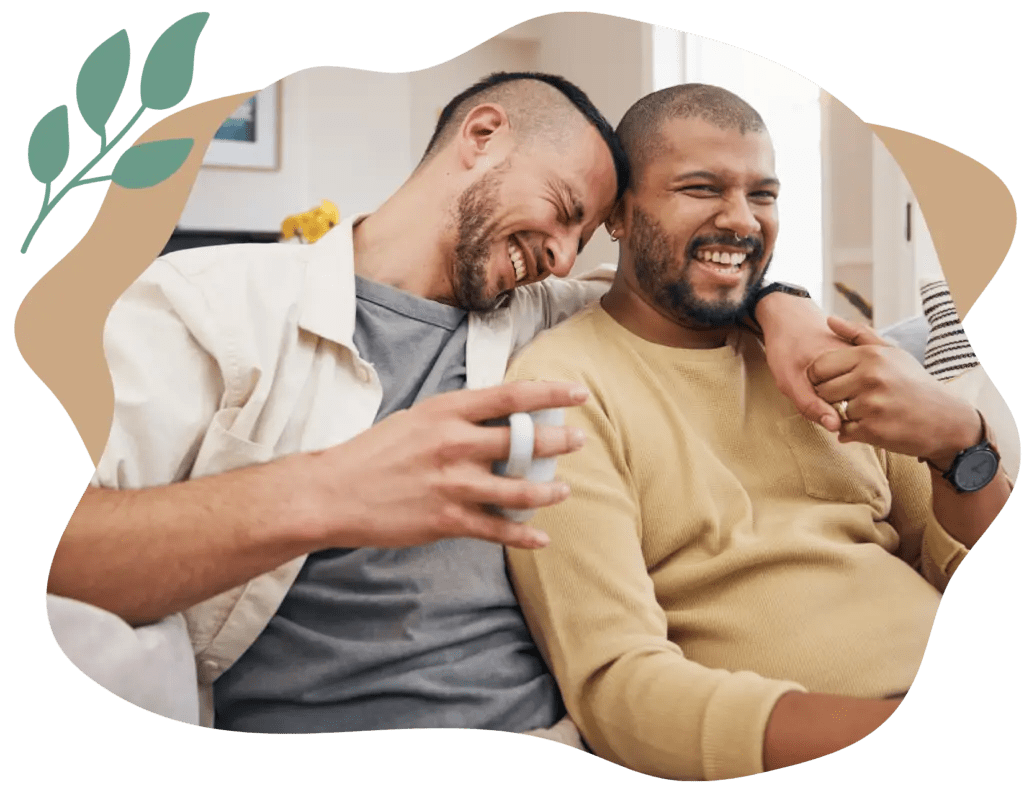 A happy couple because of online couples therapists and Man and Woman on computer doing online relationship therapy and online marriage counseling in California