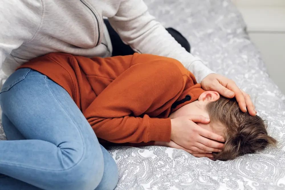 person struggling with a trauma bond