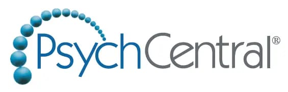 PsychCentral logo with blue and gray text; blue spheres form a curved line arching over the letter "P," evoking the calm and balance found at a wellness retreat near me.