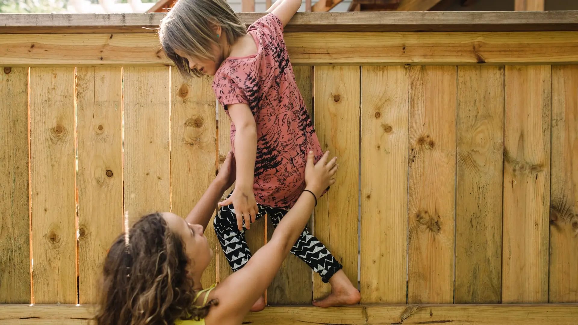 a mom helping a child get off the fence representing group therapy in san francisco for schema awareness and insecure at