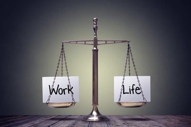 A balanced scale with "Work" on one side and "Life" on the other, symbolizing work-life balance; a c