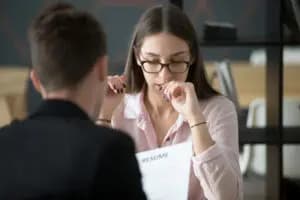 a woman looking insecure at work 