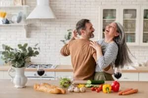 A beautiful image showing a couple holding hands and smiling, representing the love languages of Words of Affirmation.
