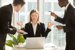a woman practicing mindfulness in the middle of work because she was bale to overcome workplace stress with anxiety therapy in san francisco at bay area cbt center 