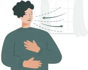 A person doing deep breathing exercises to reduce anxiety