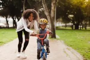 A mother and child playing together, showing consistent emotional support