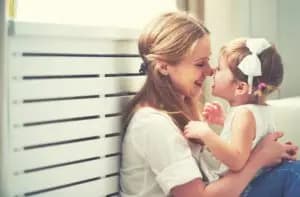 A mother and child talking, showing signs of secure attachment in children