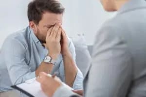 A person with OCD and OCPD talking to a mental health professional