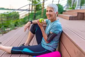 A person engaging in stress management strategies, such as physical exercise and healthy eating