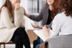 A person with OCD and OCPD talking to a family member