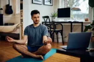 A person using a laptop mindfully and consciously