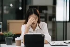 A person experiencing chronic stress, with a distressed facial expression