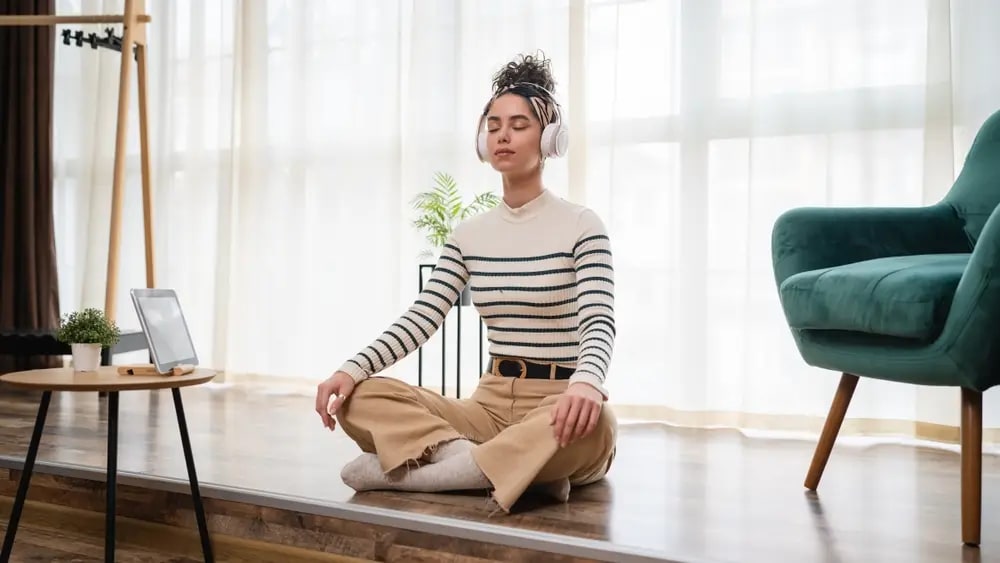A person practicing diaphragmatic breathing to reduce stress and promote relaxation