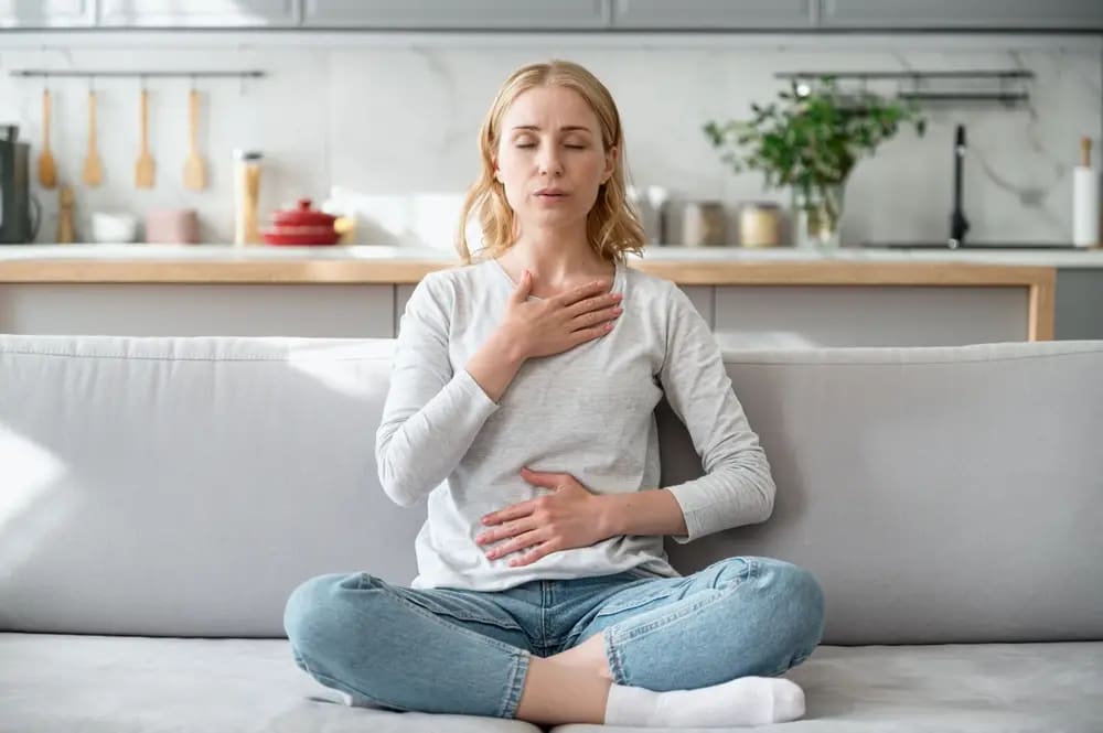 A person practicing mindfulness meditation to regulate their nervous system