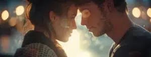 A close-up of a man and woman facing each other with their foreheads touching, illuminated by warm backlighting and surrounded by blurred lights, capturing the essence of a healthy emotional dialogue that strengthens their marriage.