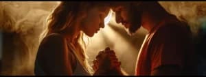 A woman and a man stand close, holding hands and touching foreheads, illuminated by a warm light from behind, creating a soft, intimate atmosphere reminiscent of moments shared in couples counseling.