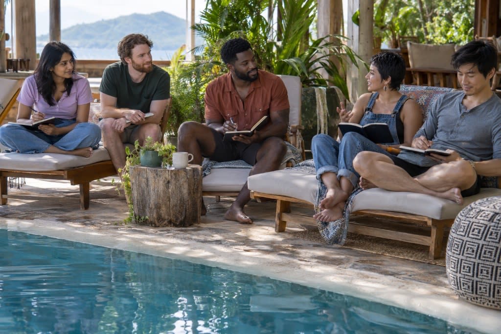 Five adults sit with journals by a pool during a small-group workshop at a California retreat.
