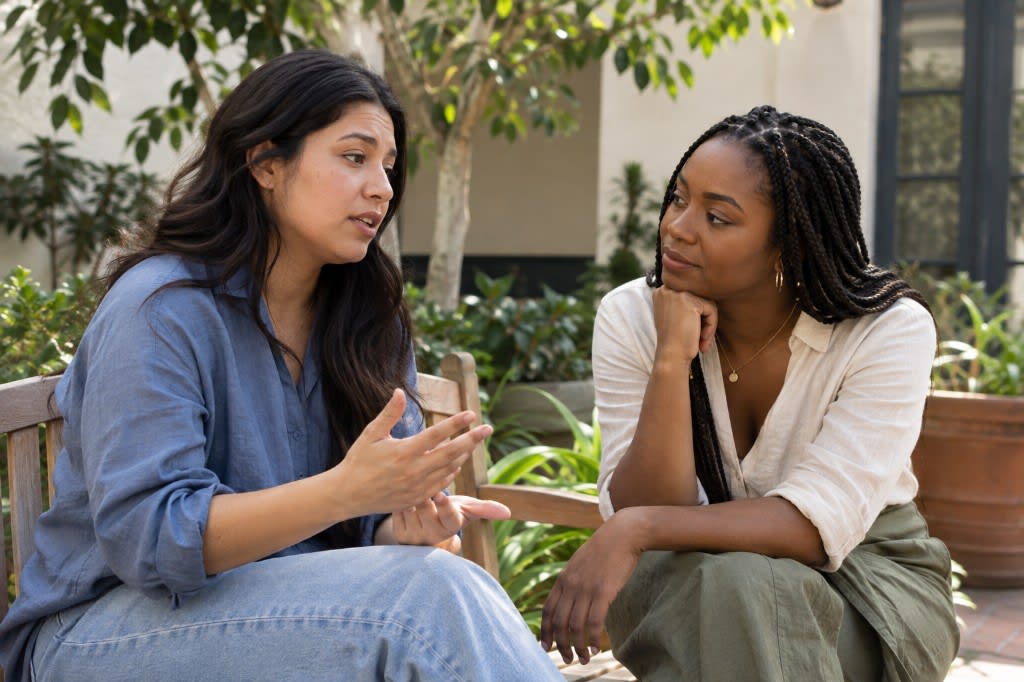 Woman talking with a trusted friend outside her relationship.