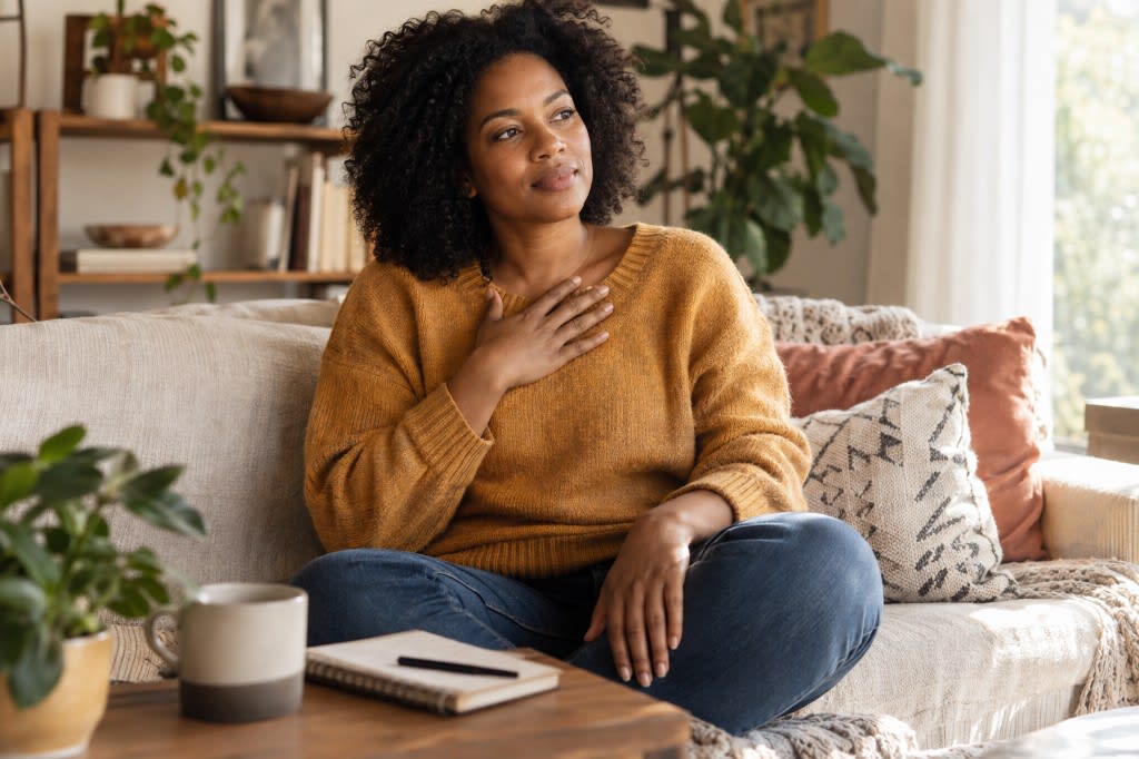 Practicing self-compassion: placing a hand on the chest during a difficult feeling