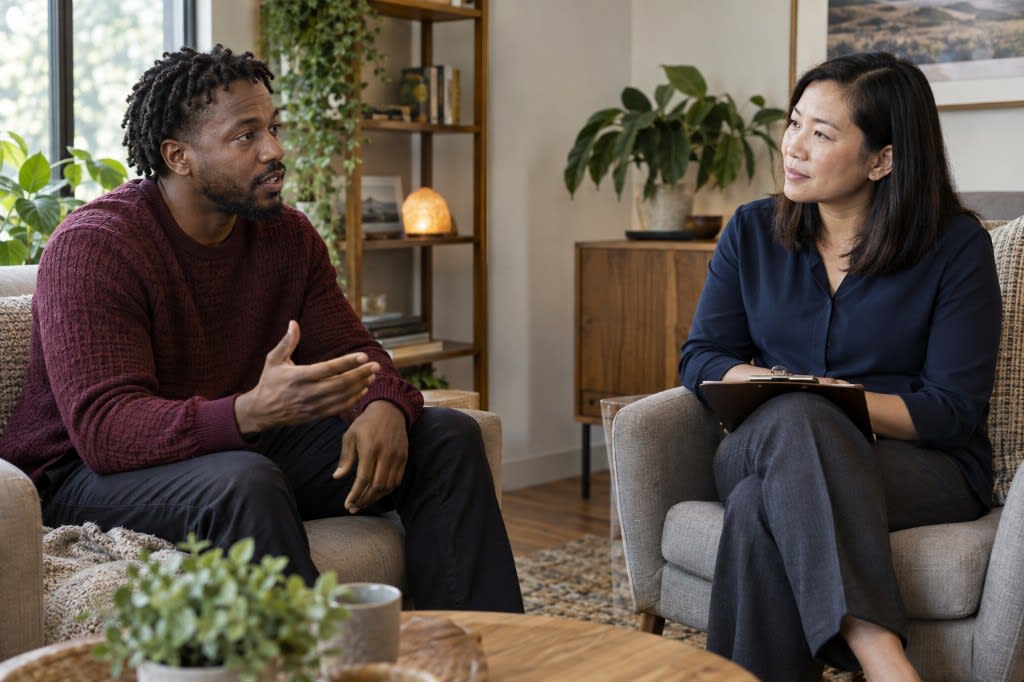Therapist assessing a client for burnout symptoms during a counseling session