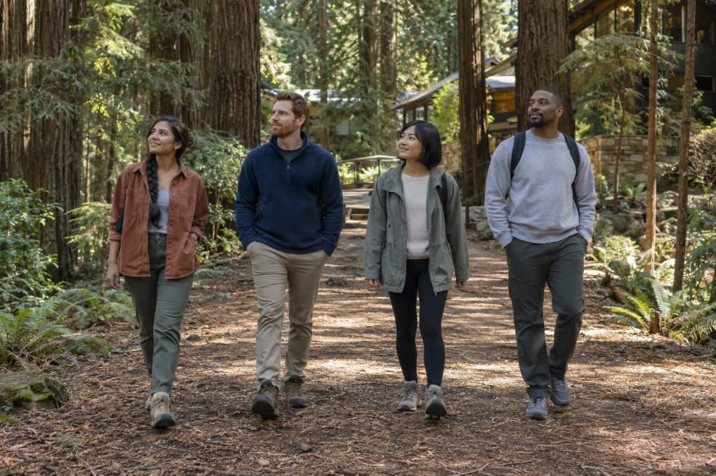 Four people walking a redwood trail at a nature-based spa retreat in California