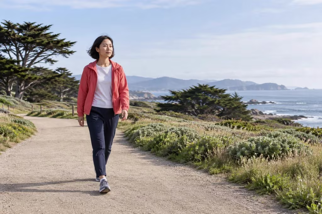Evidence-based treatment for apathy: a woman walks a coastal path as one small step back into daily life.