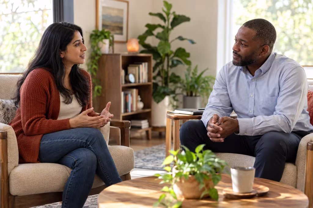 A client talks with a therapist in a calm office, therapy as a supportive environment that can change old patterns