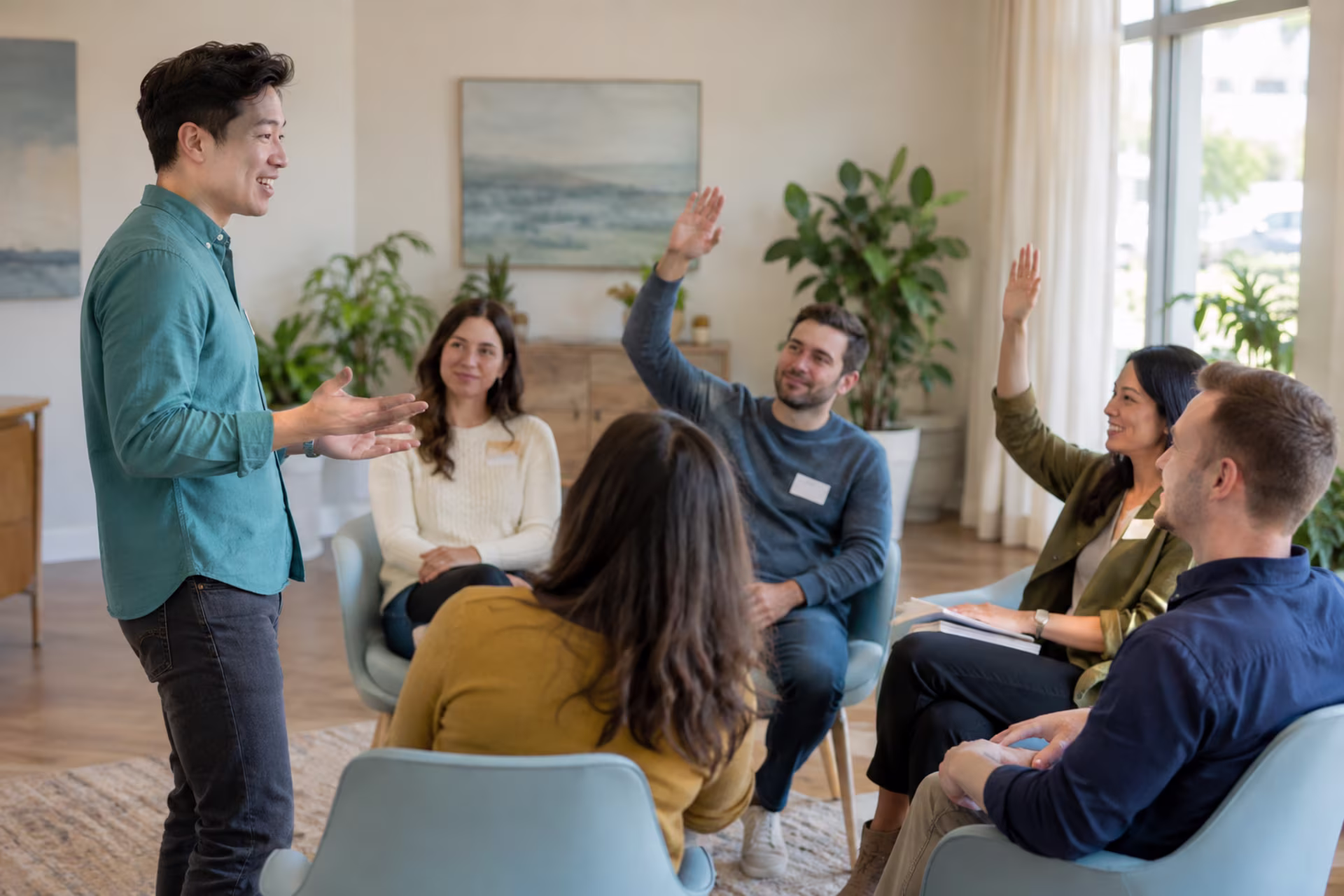 Engaging an audience during a talk as listeners raise their hands to participate