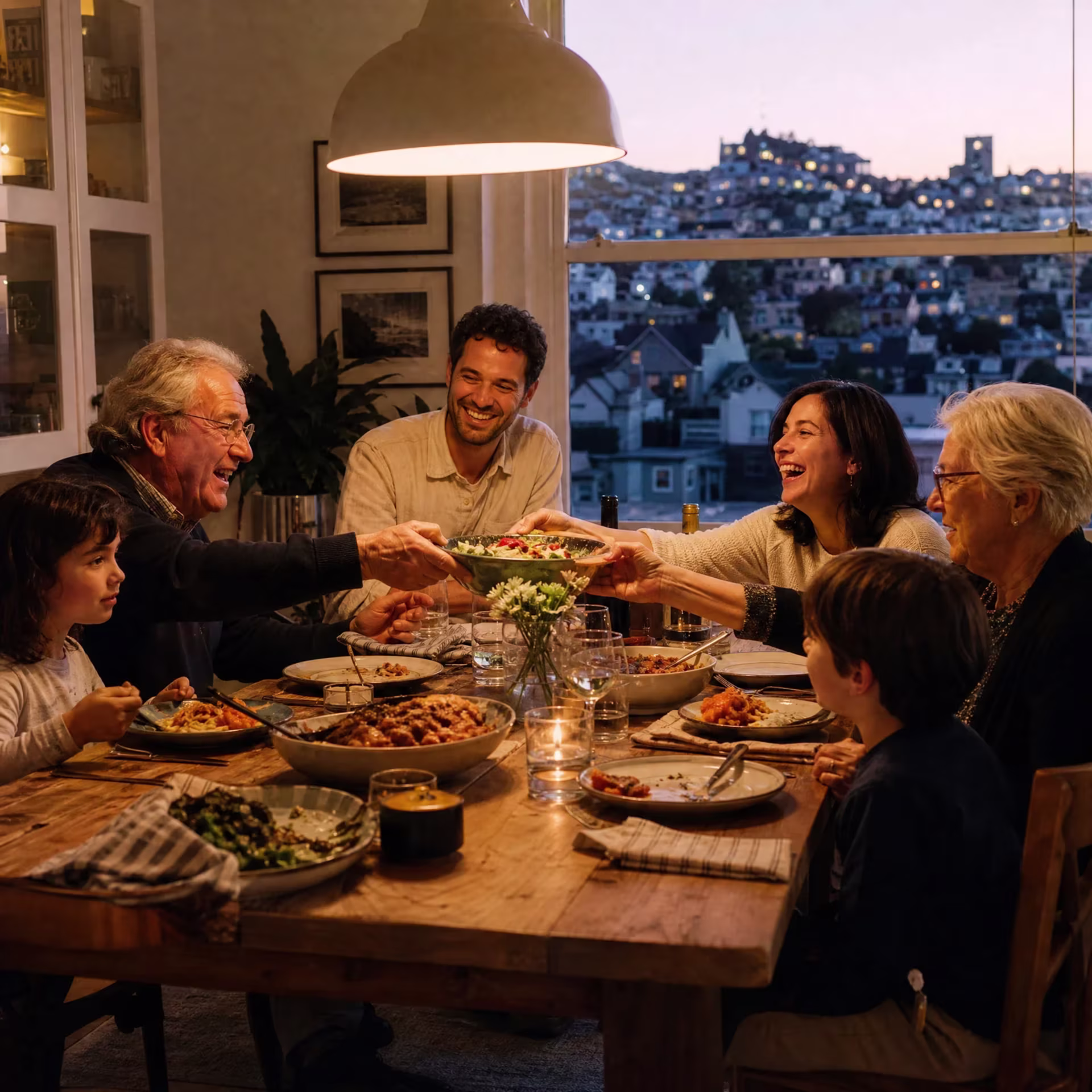 Family sharing a joyous meal together after effective family counseling in San Francisco