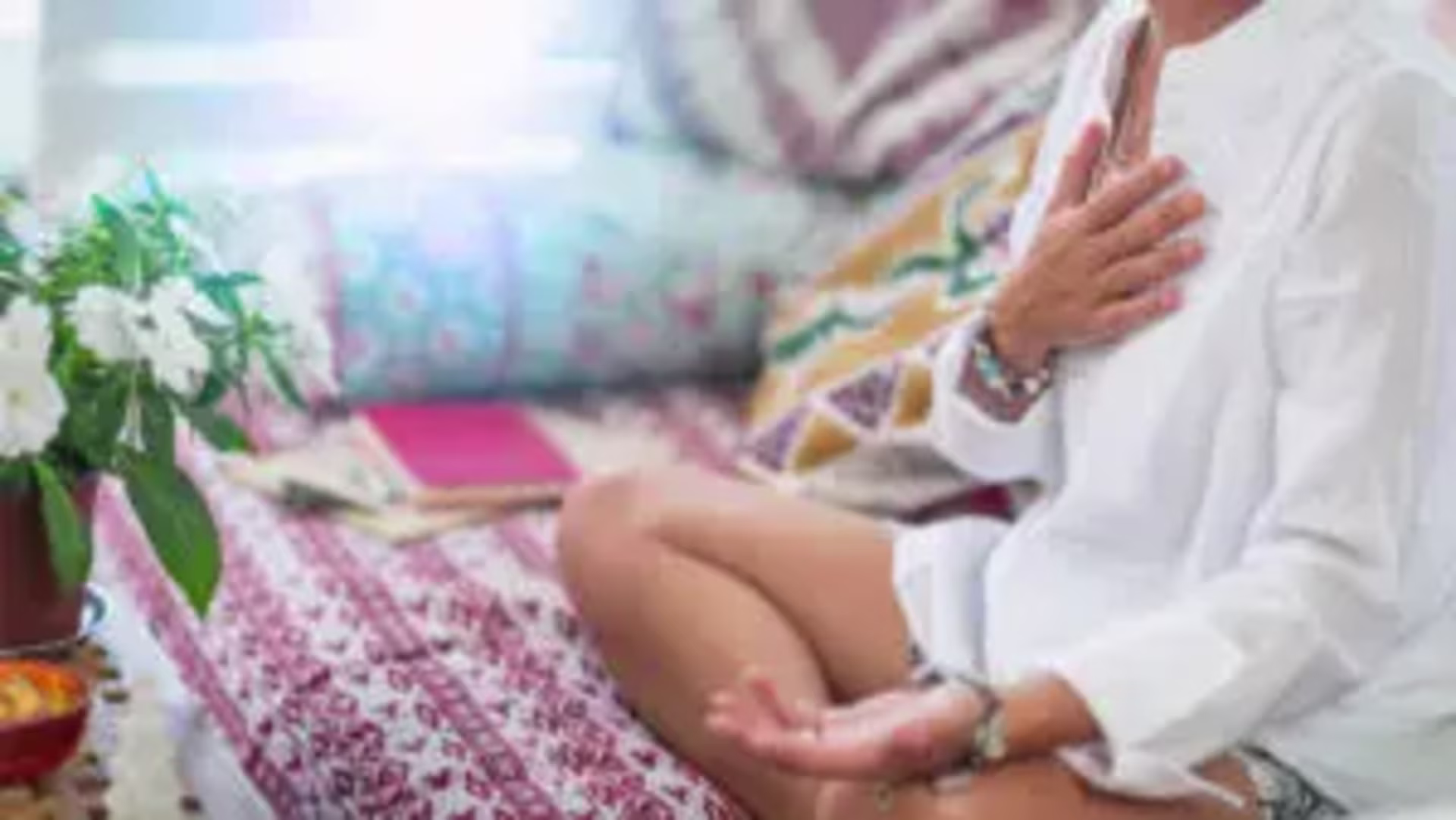 a woman with her hand on her heart becoming more compassionate after counseling in san francisco 