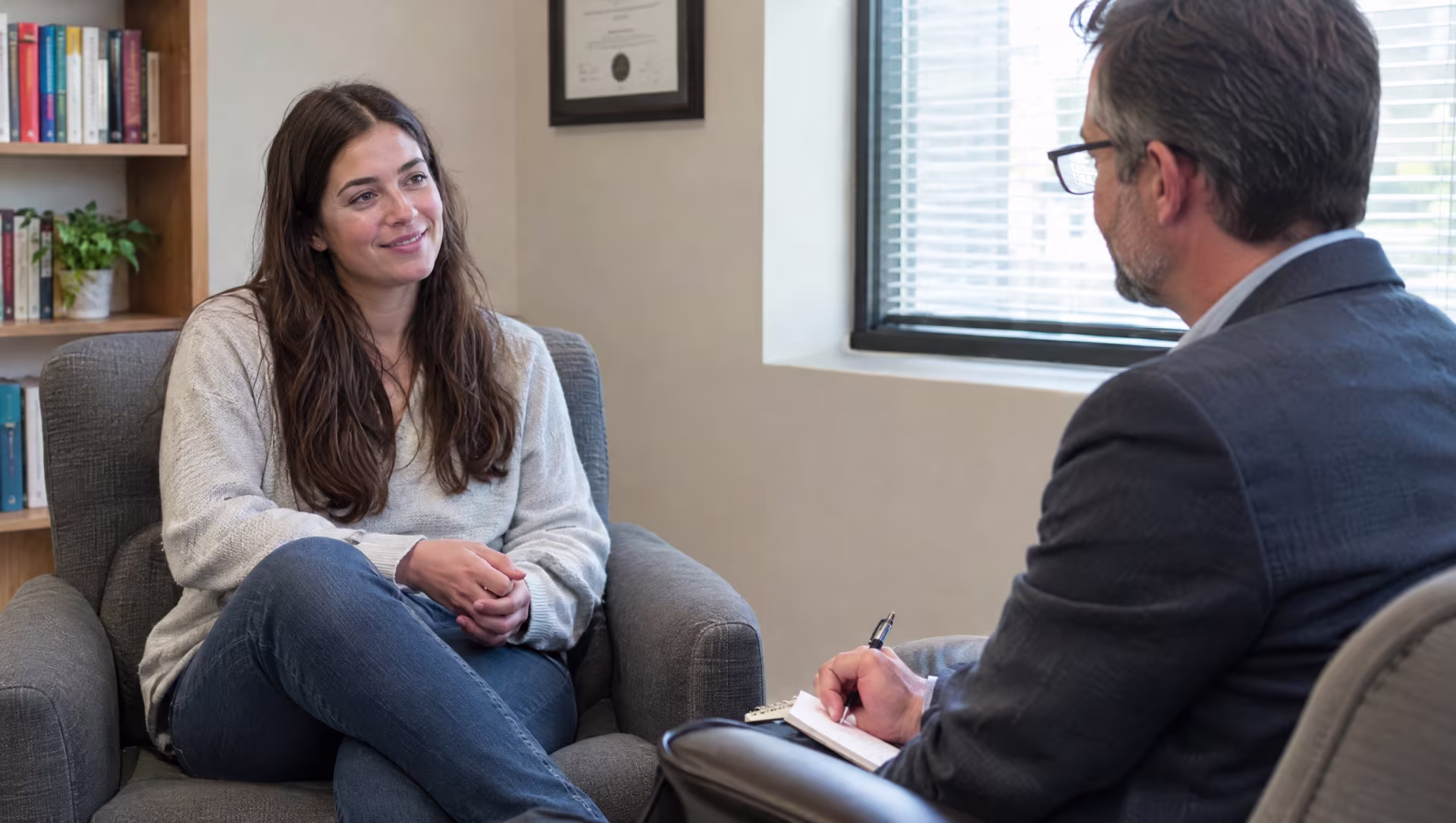 A woman talking with her therapist in person