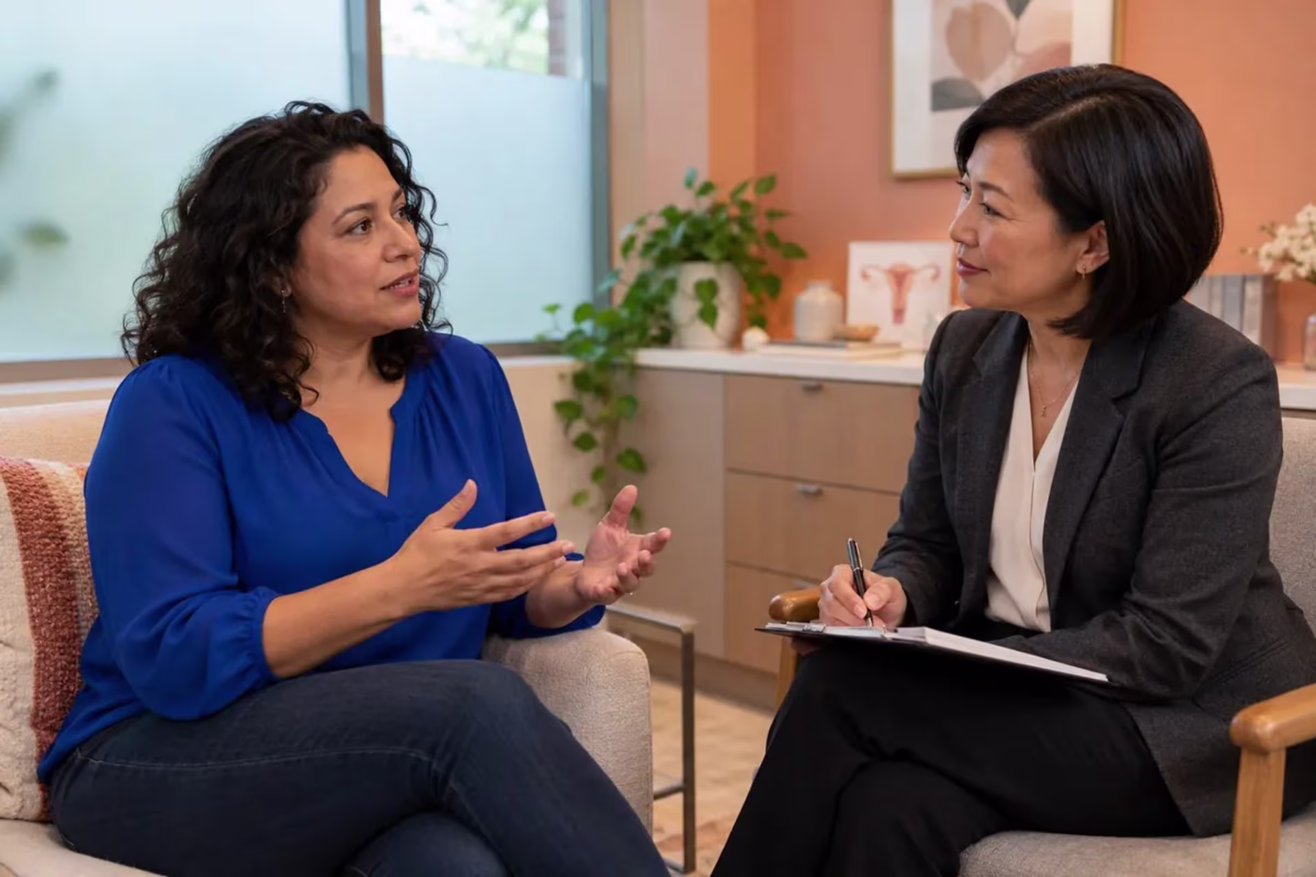 Woman discussing perimenopause symptoms and treatment options with a healthcare clinician.