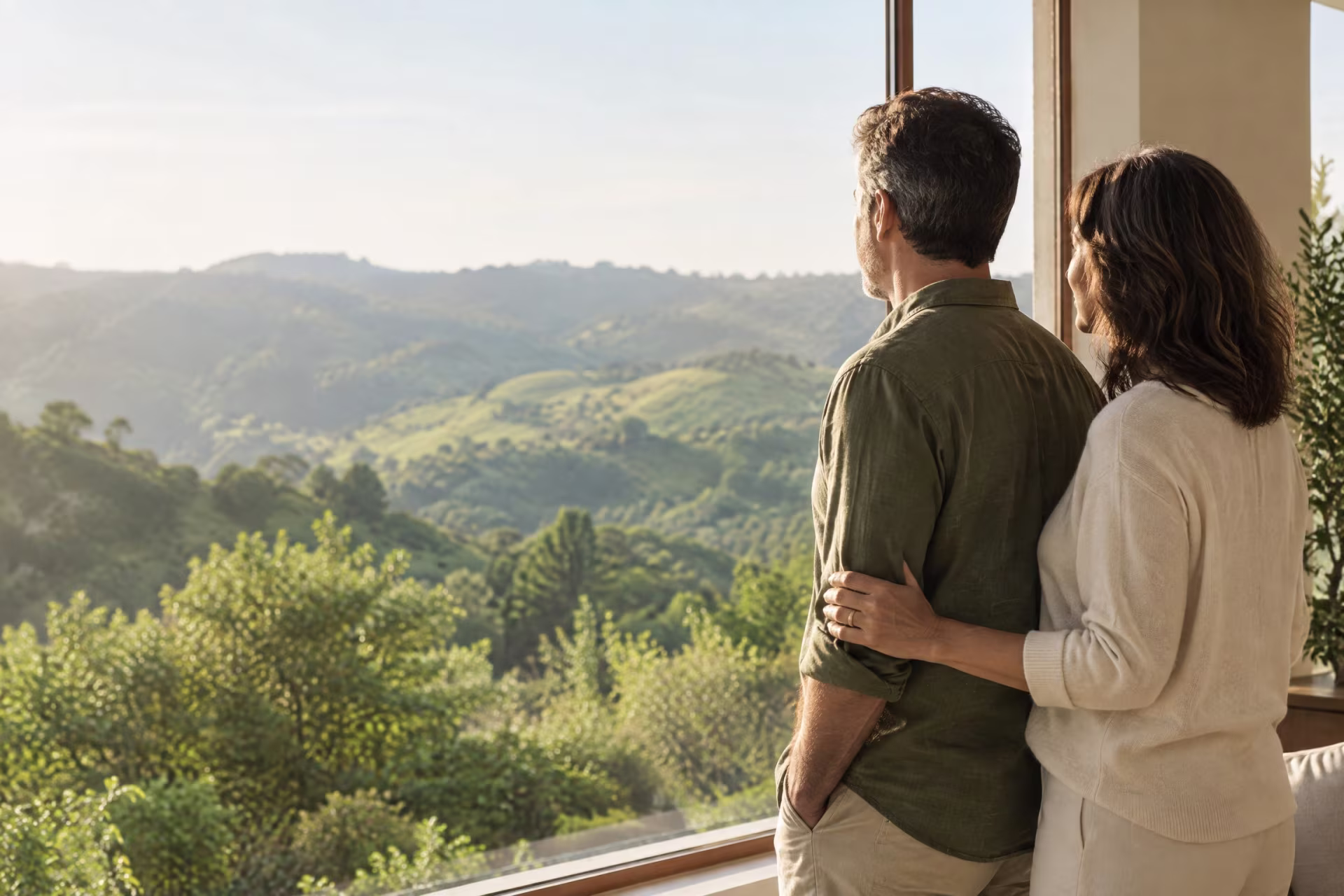 Two partners sharing a hopeful moment together by a window, couples therapy in San Jose near me
