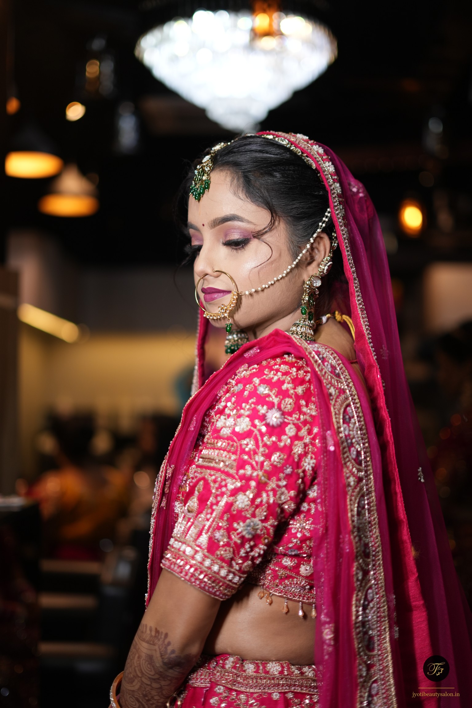 Bridal profile at Jyoti Beauty Salon showing intricate mehendi and a gold nath with pearl chain in Chapra.