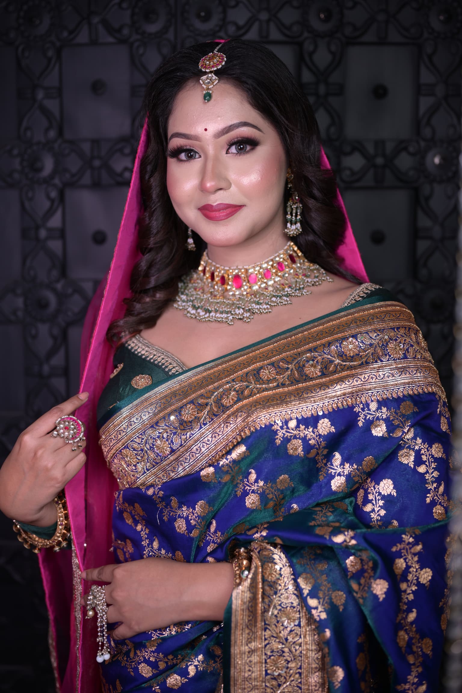 Indian bridal makeup artist for traditional wedding look.