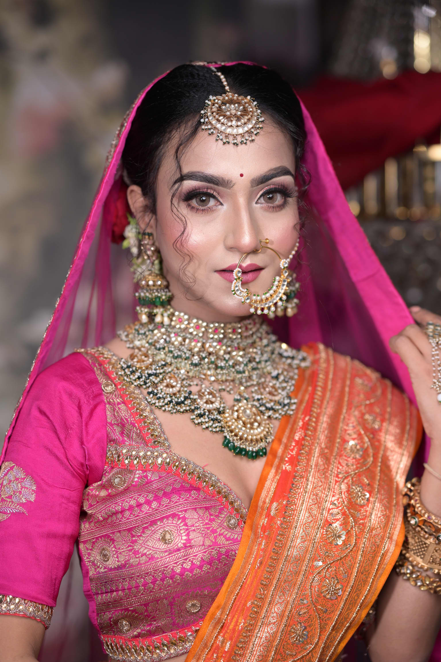 Stunning Indian bride with traditional makeup and exquisite jewelry.